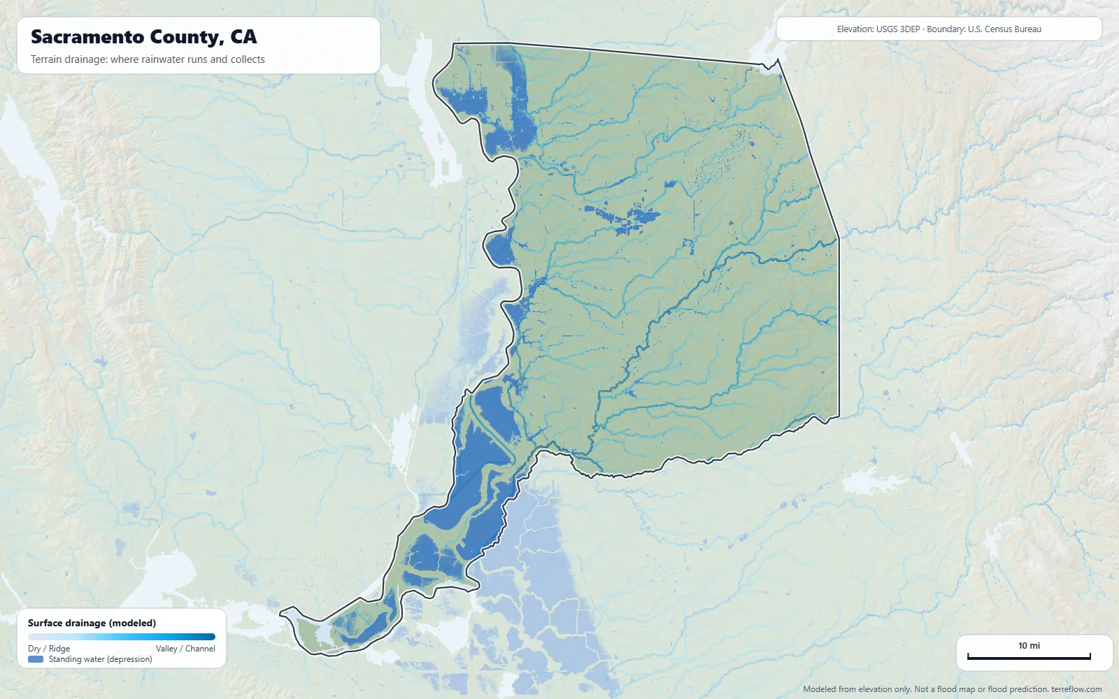 Terrain drainage map of Sacramento County, CA: modeled paths where rainwater runs and collects, from USGS 3DEP elevation data, with the county boundary